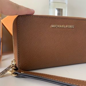 A MK acorn wristlet